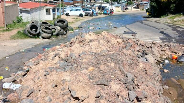 Raw sewage floods this Durban main road