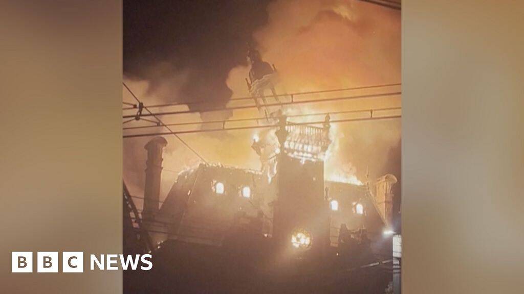 Watch: Moment historic French town hall spire collapses in flames amid protests
