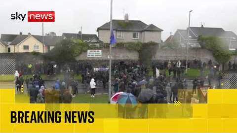 Crowds gather as Orange Order given go-ahead to march down nationalist street in Northern Ireland