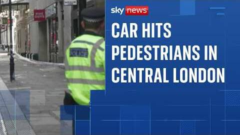 Woman arrested after car hits three pedestrians