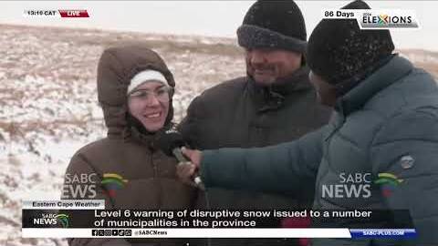 Familes brave icy conditions to experience rare sighting of snowfall
