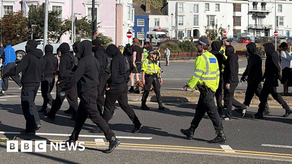 Use all powers necessary on anti-migrant protests, home secretary tells police