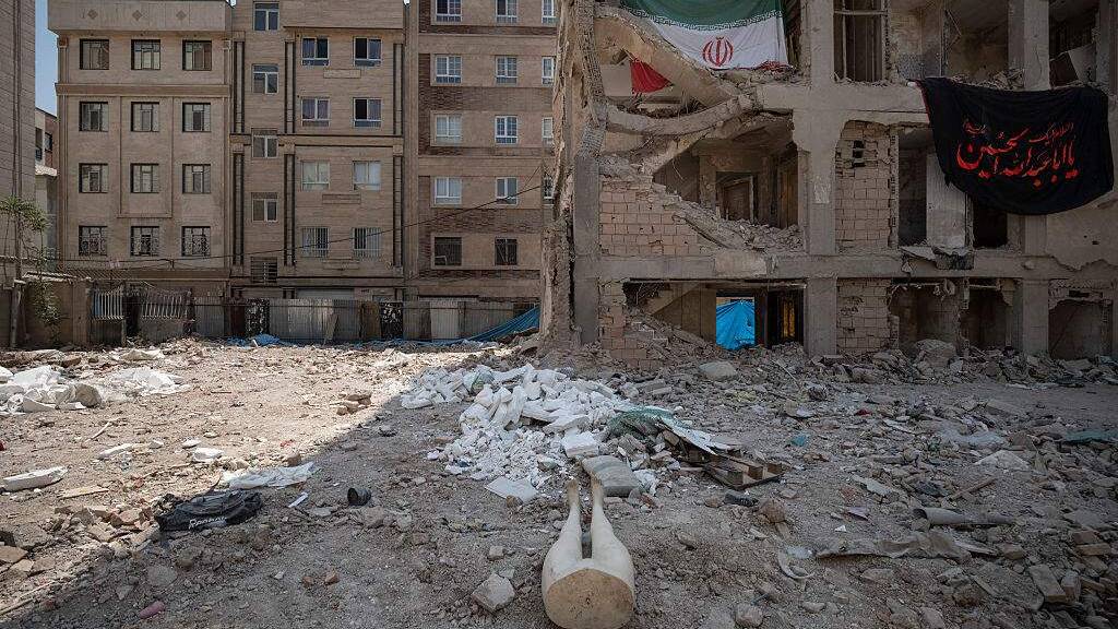 Under airstrikes, Iran defiant on eve of Trump's ceasefire deadline