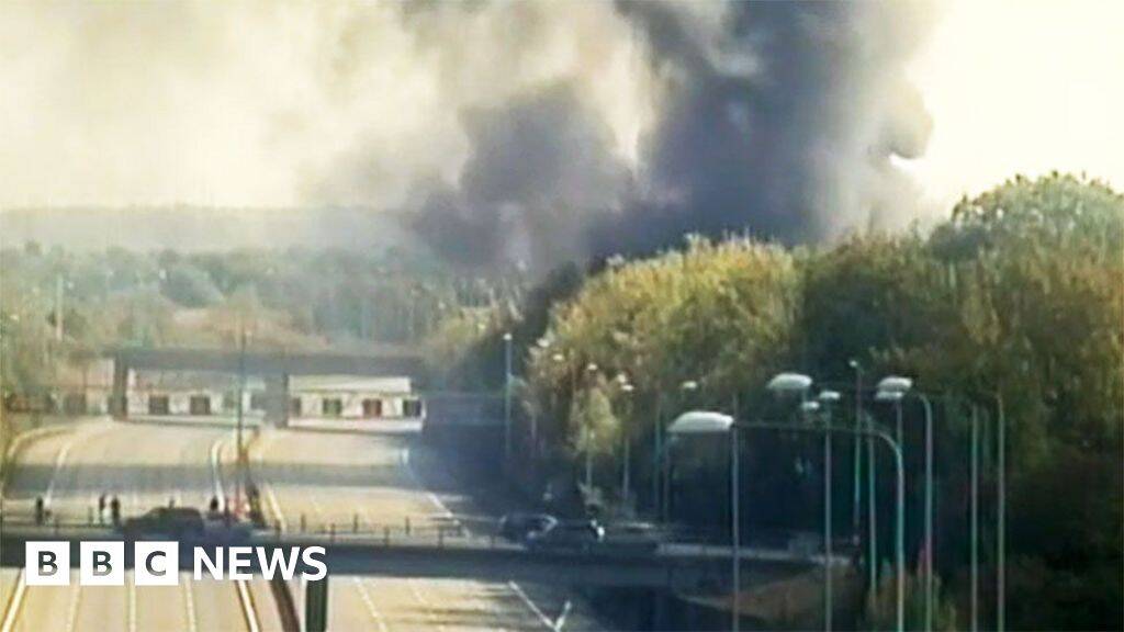 Risk of explosion at warehouse fire closes M25