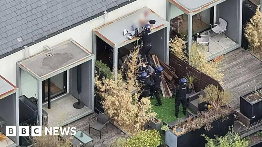 Watch moment police arrest wanted man while he slept on roof