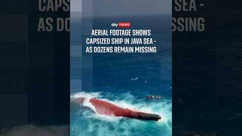 Aerial footage shows capsized ship in Java Sea - as dozens remain missing