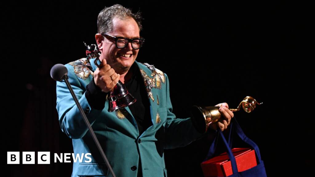 Alan Carr holds back tears on special night at National Television Awards