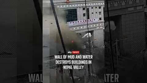 Wall of mud and water destroys buildings in Nepal valley
