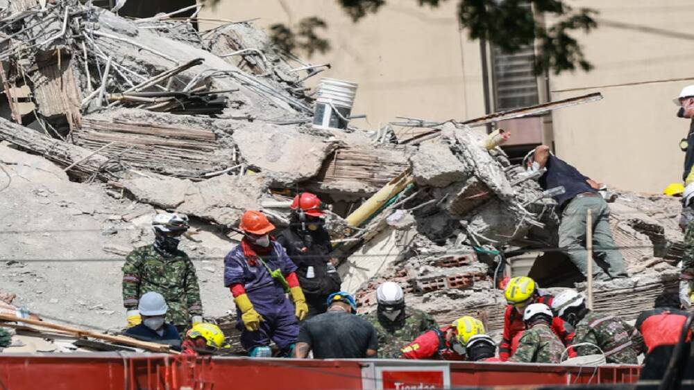 Race to reach trapped survivor offers hope in Colombia quake zone