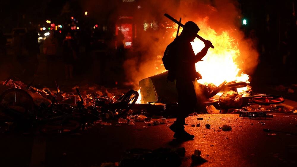 France counts cost of unrest, Paris tensions flare again