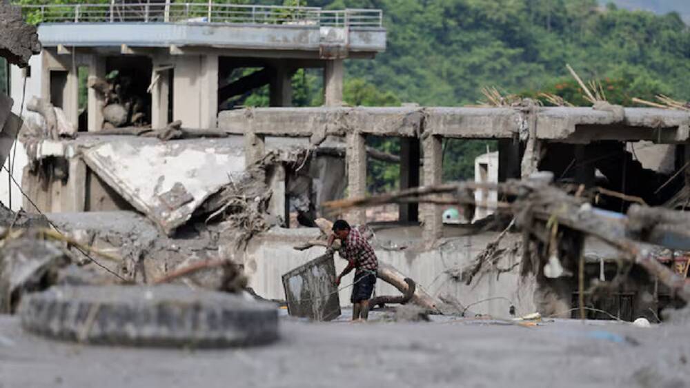 Nepal, China warn of fresh flood risks as lake threatens to burst