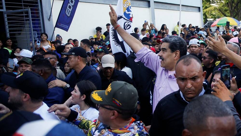 Maduro joins rowdy youth rally, exchanges ‘shoves of love’ with supporters
